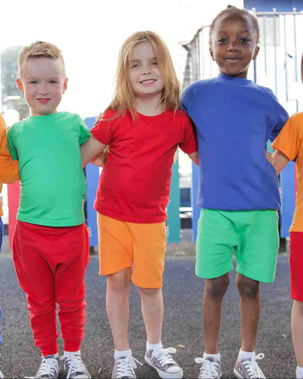 A trio of children shown wearing Hues Clothing
